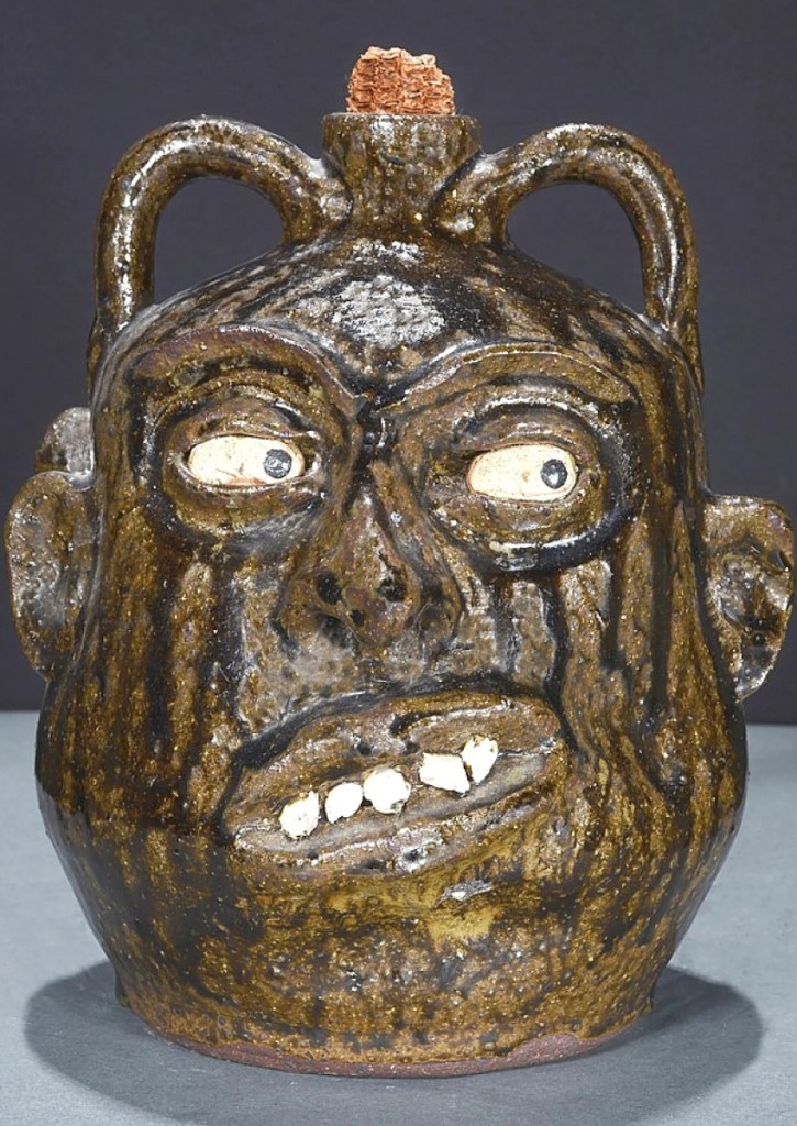 “I’d like to have seen that bring a little more,” Steve Slotin said about the $3,125 realized for this circa 1960s rock tooth double-face politician jug by Lanier Meaders, which was 9 inches tall ($3/5,000).