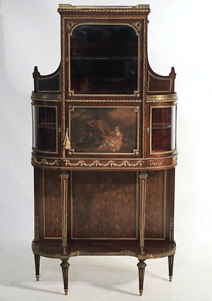 “It was a wonderful piece,” Jeremy Wooten said of this circa 1900 French mahogany and bronze mounted vitrine with glazed side cabinets and a painted center door. It brought $9,000 from a buyer in New York City ($3/5,000).