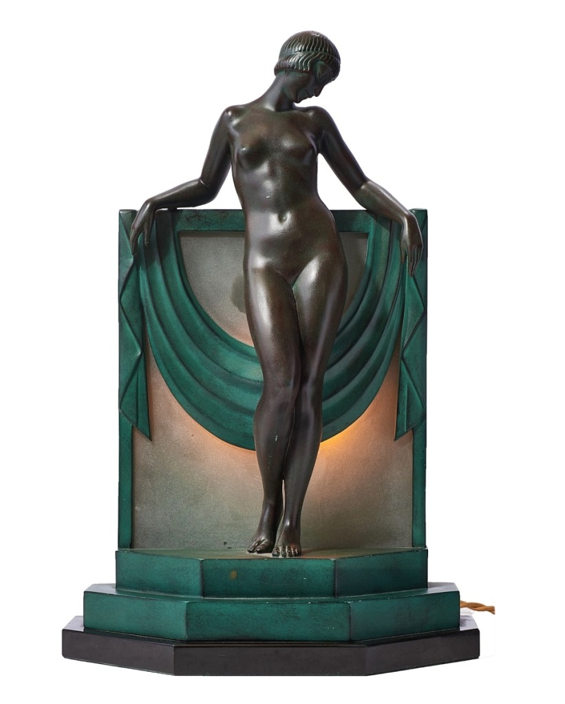 Highlighting decorative arts was an Art Deco-style bronze figural table lamp, after a model by Feral ne Pierre Le Fageays (French, 1892-1962) with applied patina and modeled as nude figure posed in front of draped swags raised on a stepped pinch base. It sold for $5,120.