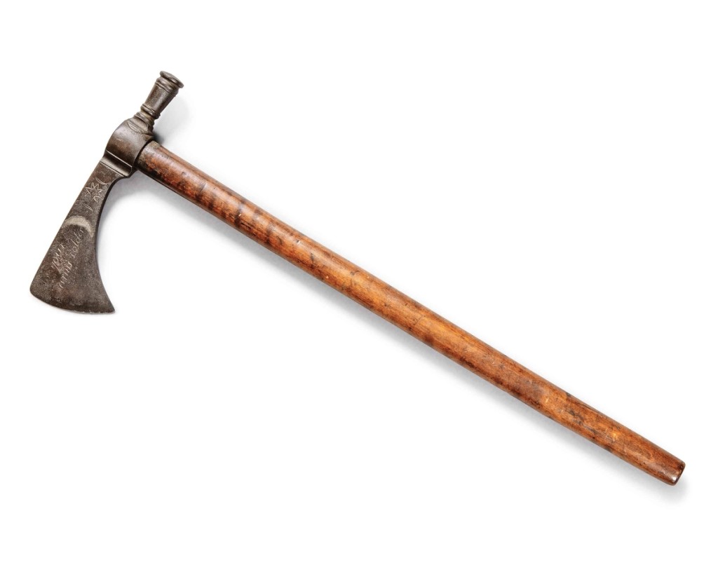 This engraved steel and silver inlaid poleaxe tomahawk, circa 1770, found a new home for $107,100 (Du Pont Collection, $60/80,000).