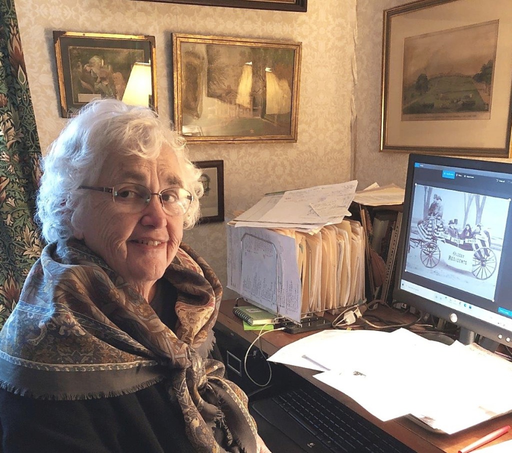Jane Nylander, busy at work on the book, the image on her   computer screen is that on page 38 in the book featuring the   “Oldest Residents” in Manchester, N.H., Centennial, 1896.