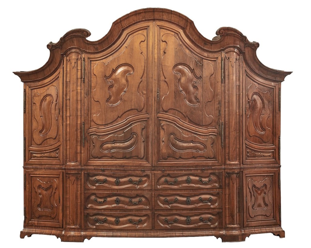 Flowing bold lines and grand scale denoted this early Eighteenth Century Italian Baroque walnut armadio, which sold to a California decorator for $18,750 ($4/6,000).