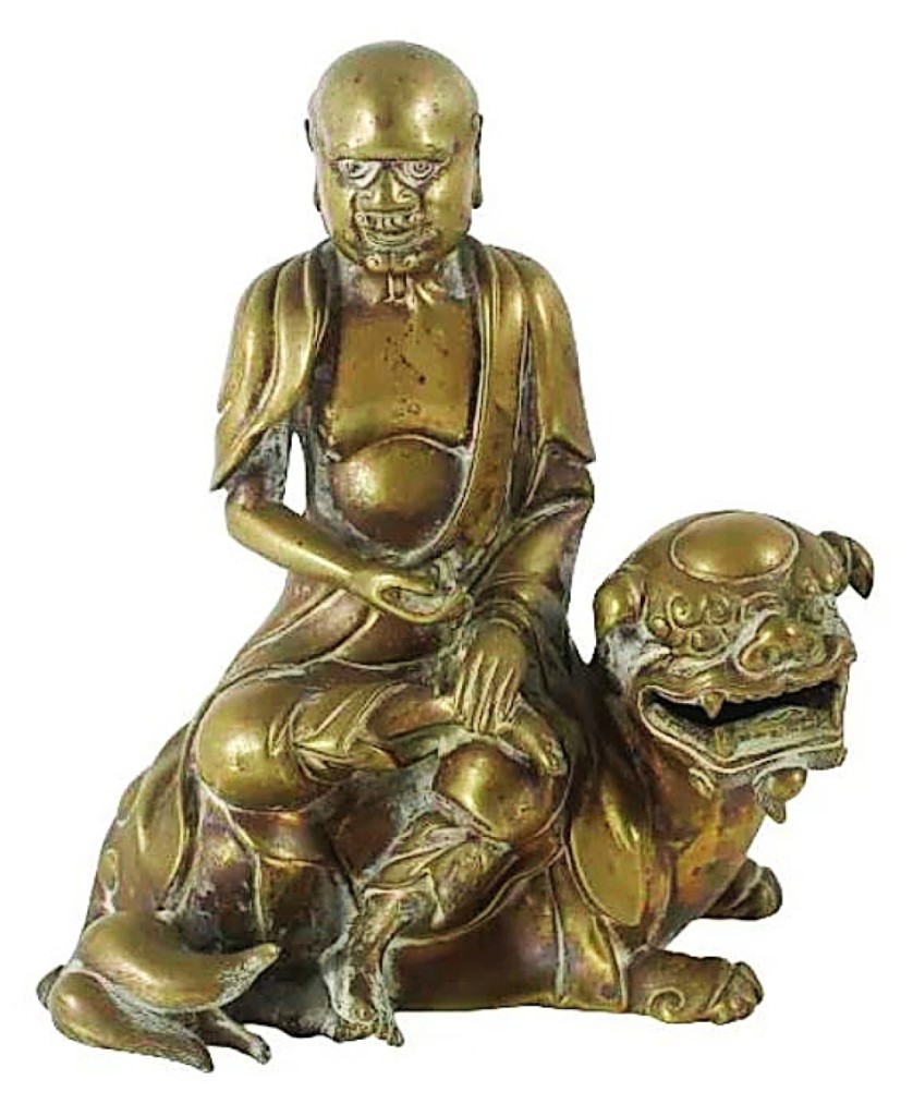 An early Chinese bronze Buddha riding a Qilin dragon was exquisitely stylized, prompting bids that took it to nearly 16 times its high estimate to finish at $18,900.