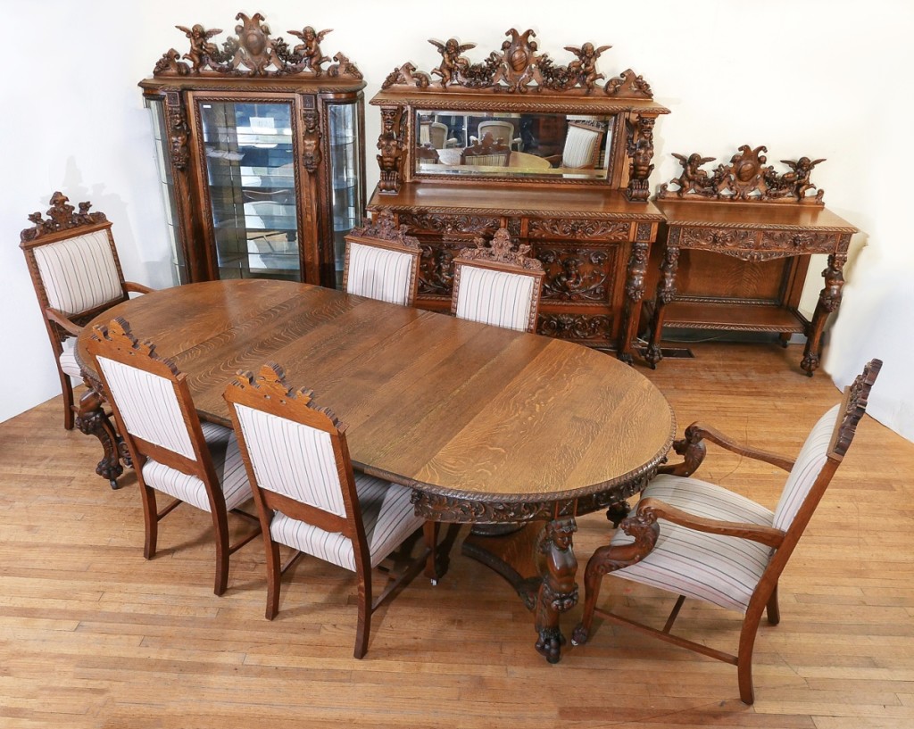 The sale’s showstopper was a ten-piece R.J. Horner quartersawn oak dining suite, which the auction house described as “carved to death oak in original finish.” Featuring carved full-bodied winged putti and floral festooned backsplashes, bare breasted caryatids and Mountain Man side supports, the suite brought $31,050.