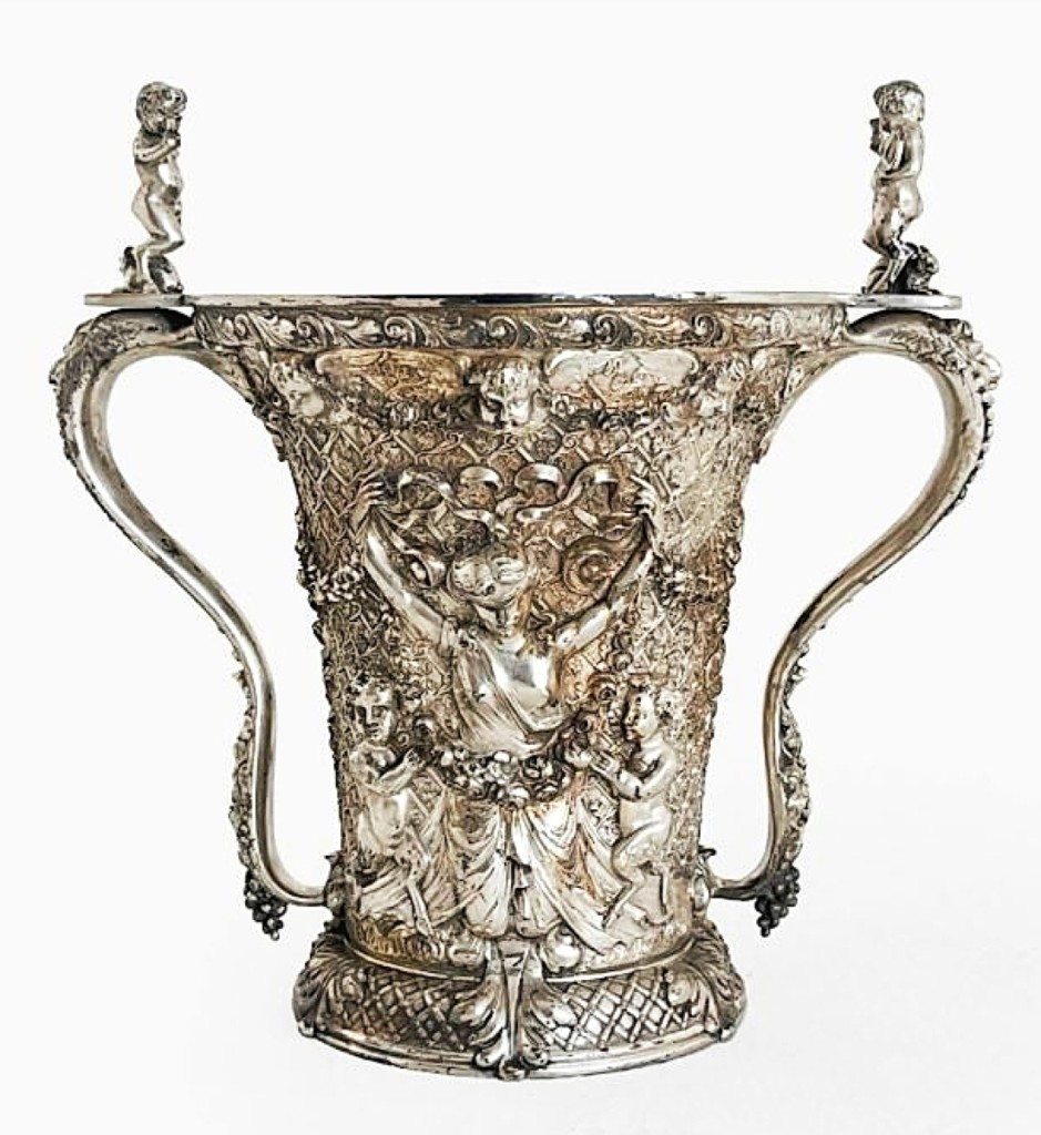 A Tiffany & Co. sterling silver loving cup sold for $41,250, more than twice the high estimate. Property from the estate of Marian Galewitz, the cup, weighing 3,274 grams, depicted Pan playing a flute on one side and Themis being led astray on the other.