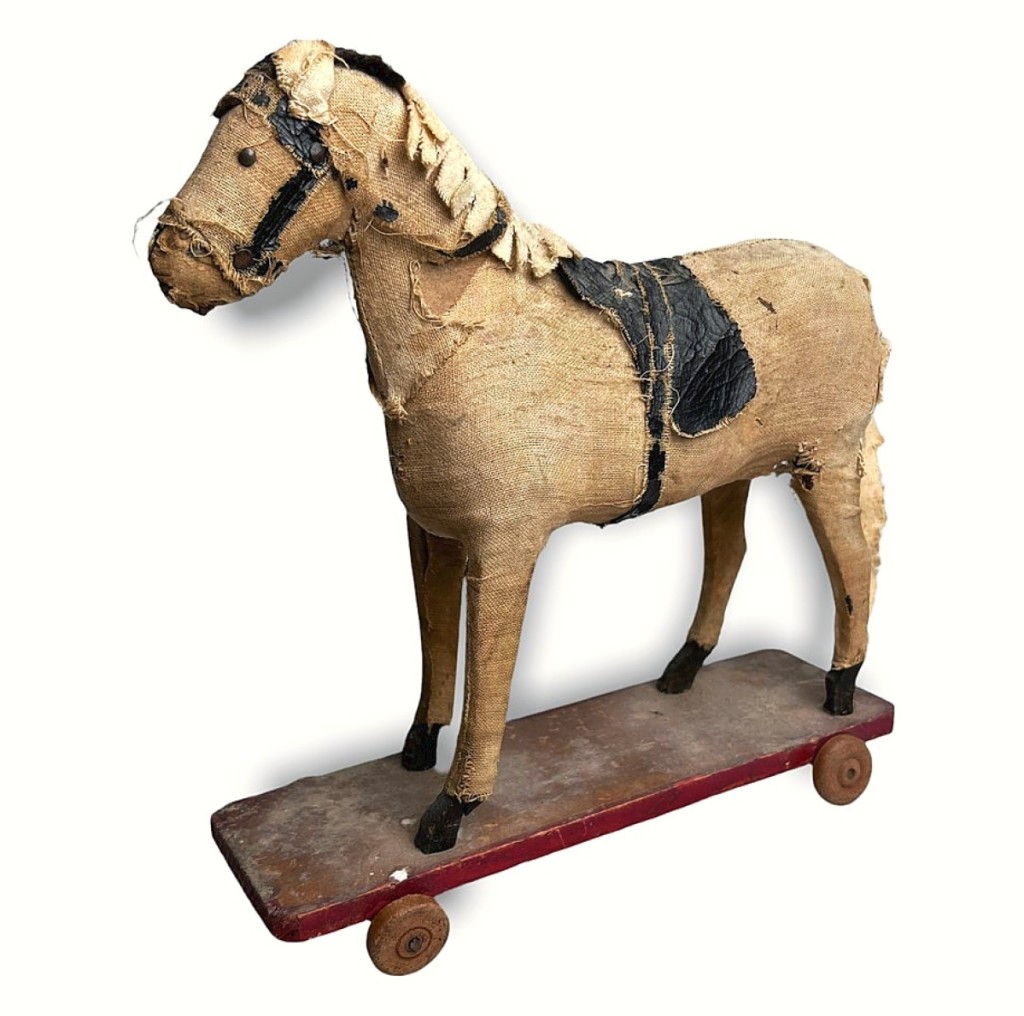 One of about half a dozen sales by Ziebarth’s Antiques was this Nineteenth Century papier mache horse pull toy on wooden platform. Avoca, Wisc.