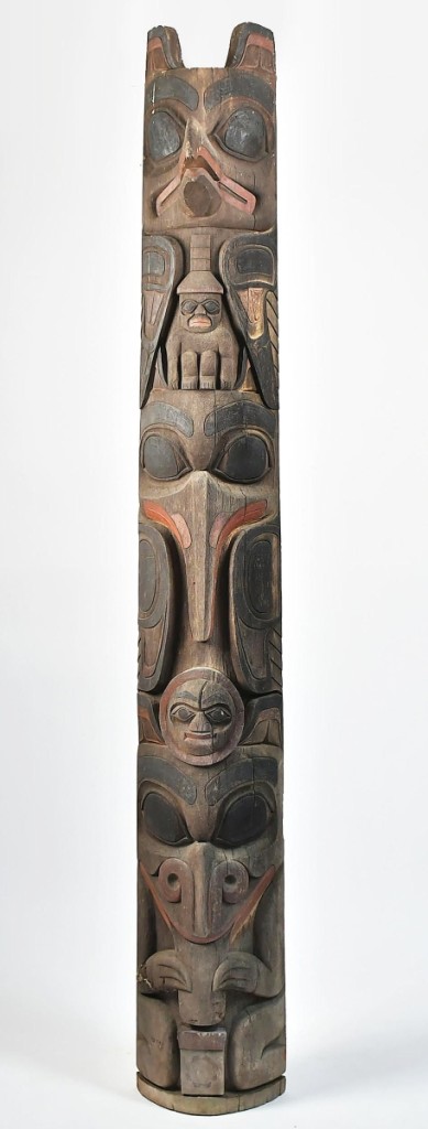 An 8-foot-tall carved cedar totem pole was the highest priced item in the sale. With several carved effigies, it was collected in Alaska in the 1950 or 1960s and it sold for $23,600.