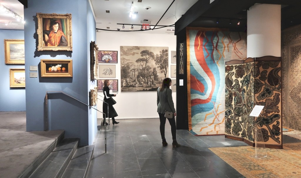 The show’s unconventional floor plan offered arresting views from every direction. From left, American paintings at Thomas Colville Fine Art, vintage wallpaper at Carolle Thibaut-Pomerantz and antique carpets and tapestries at Keshishian.