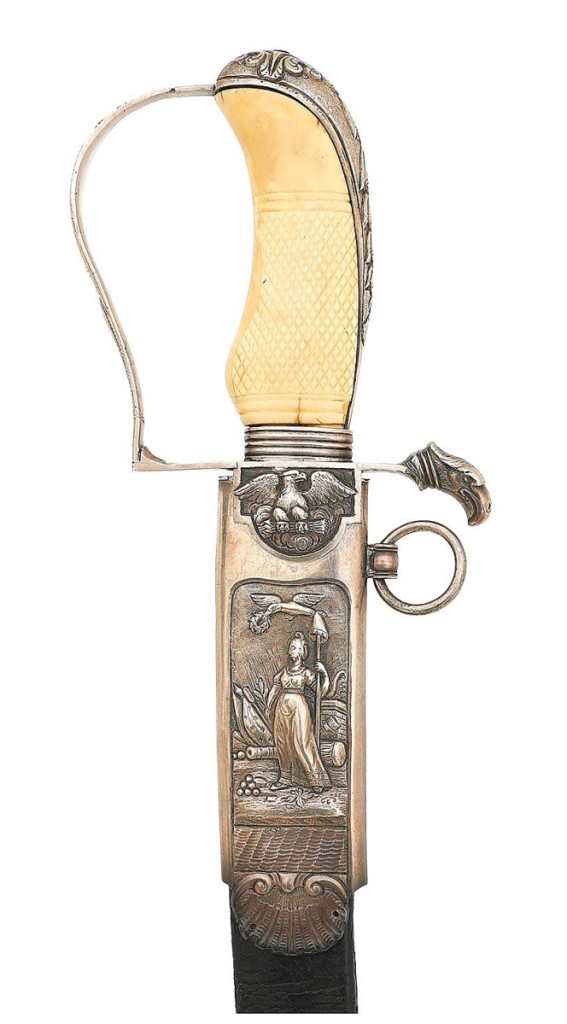 A 6-inch figure of Lady Liberty in high relief decorated the scabbard of this sword, along with an American eagle clutching arrows, and more. The Philadelphia silver hilt had a bird’s head pommel, an ivory grip, and the blade was engraved with patriotic motifs. It was the highest priced sword in the Tillou collection, reaching $22,325.