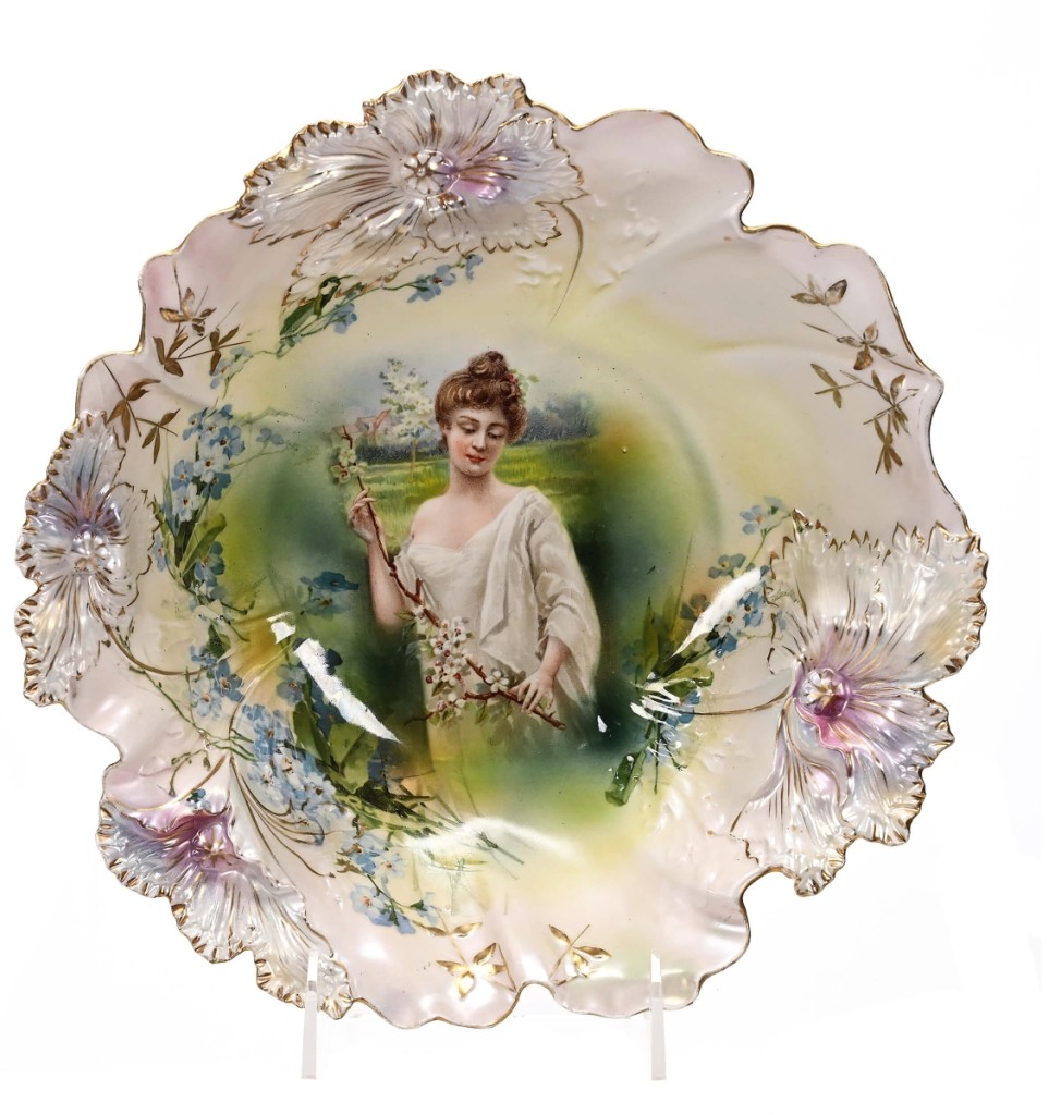 Bowl marked R.S. Prussia, 10½ inches in diameter with a portrait décor and a lavender and white satin finish — the only known example of a Spring Season bowl in the Carnation mold — sold for $24,000.