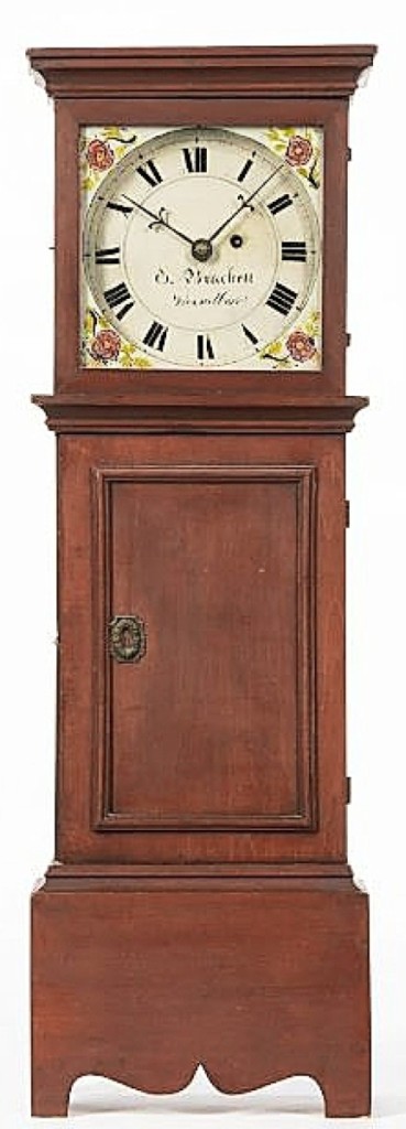 A red-stained maple Oliver Brackett dwarf clock, Vassalboro, Maine, circa 1840s, jumped its $10/15,000 estimate to land at $146,890. It featured a flat-top case with hinged upper door, reverse-painted floral-decorated tablet and painted Roman numeral iron dial with black surround. The sale’s catalog noted that a similar clock is shown in Furniture Treasury by Wallace Nutting, plate 3420, and this specific clock is pictured in a Eugene J. Sussel March 1950 ad in The Magazine Antiques.