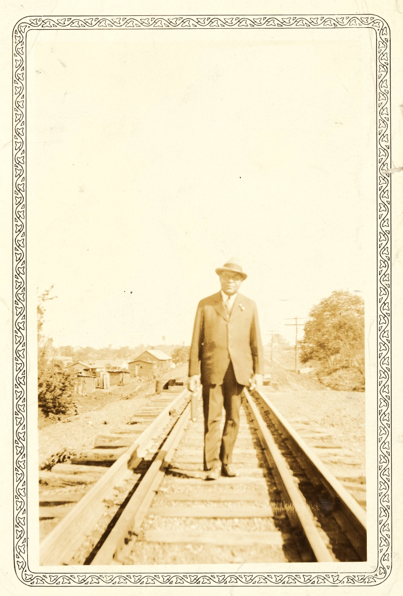 Schomburg_Portrait of Arturo Schomburg standing on railroad track, ca