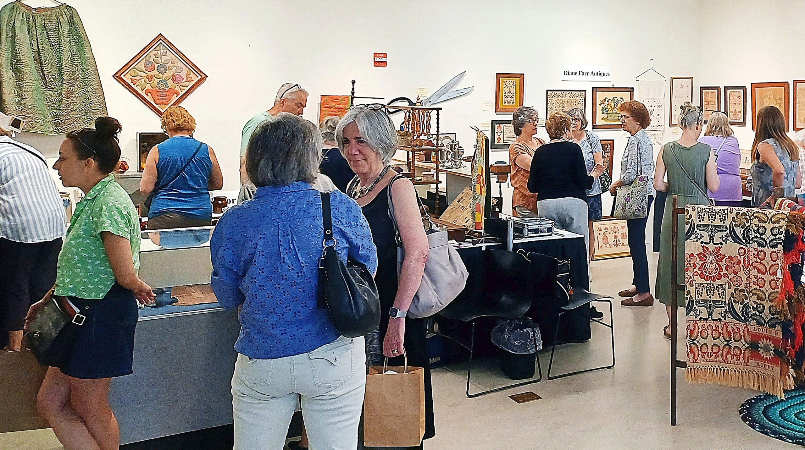https://www.antiquesandthearts.com/wp-content/uploads/2023/06/2.-The-exhibit-hall-was-a-flurry-of-activity-at-the-Penn-Dry-Goods-Markets-annual-show-and-sale.--scaled.jpg