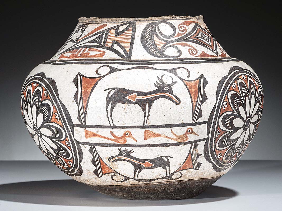 This Zuni polychrome pottery olla with floral medallions and hea