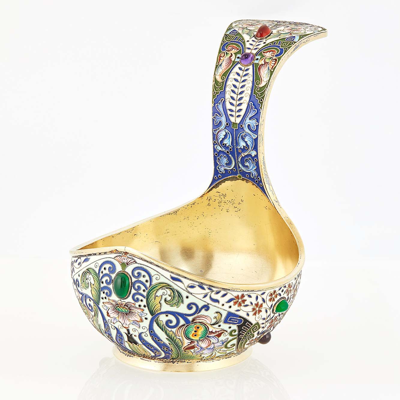 This Russian silver-gilt and cloisonné enamel kovsh by Feodor R