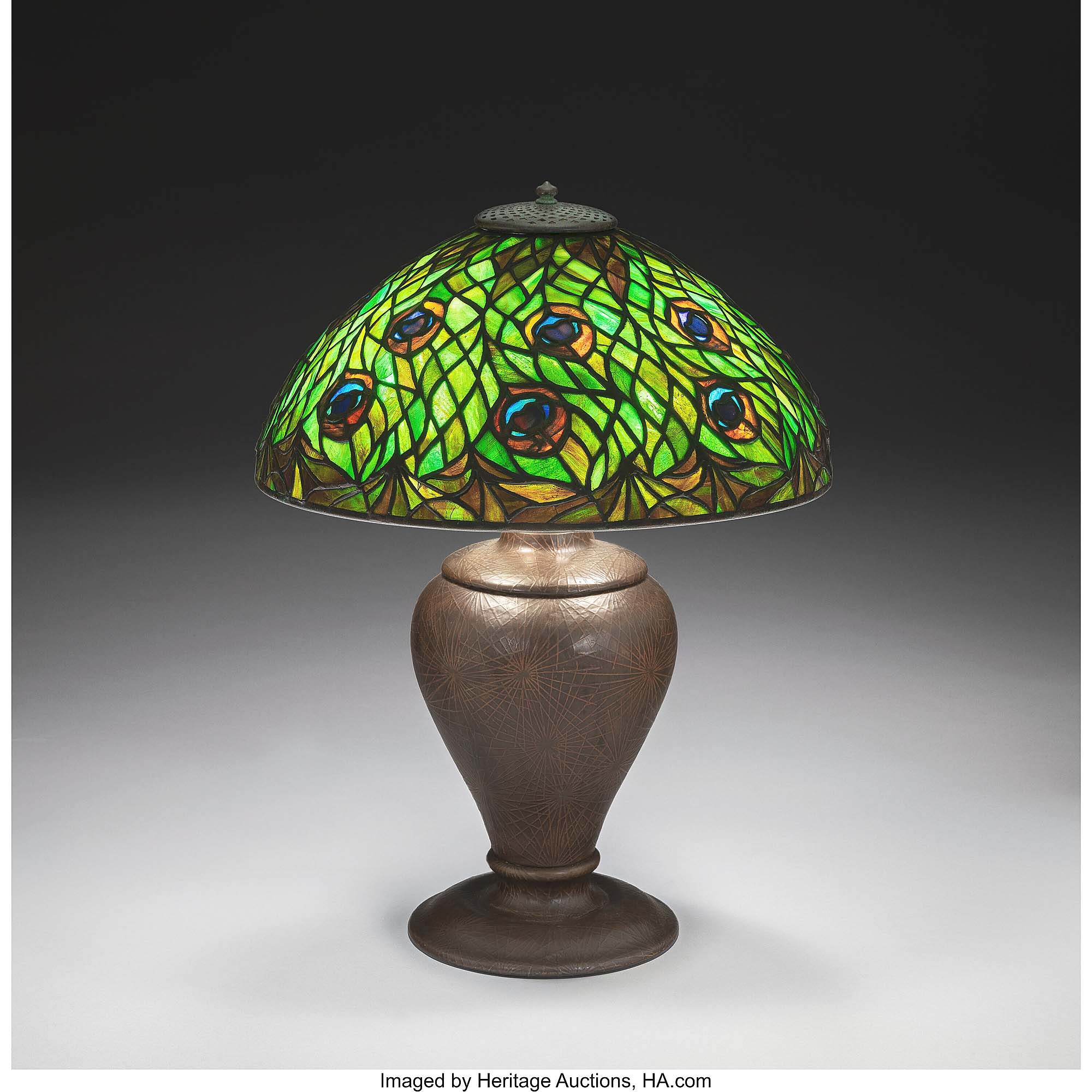 Made circa 1910, this Peacock shade topped a patinated bronze ba