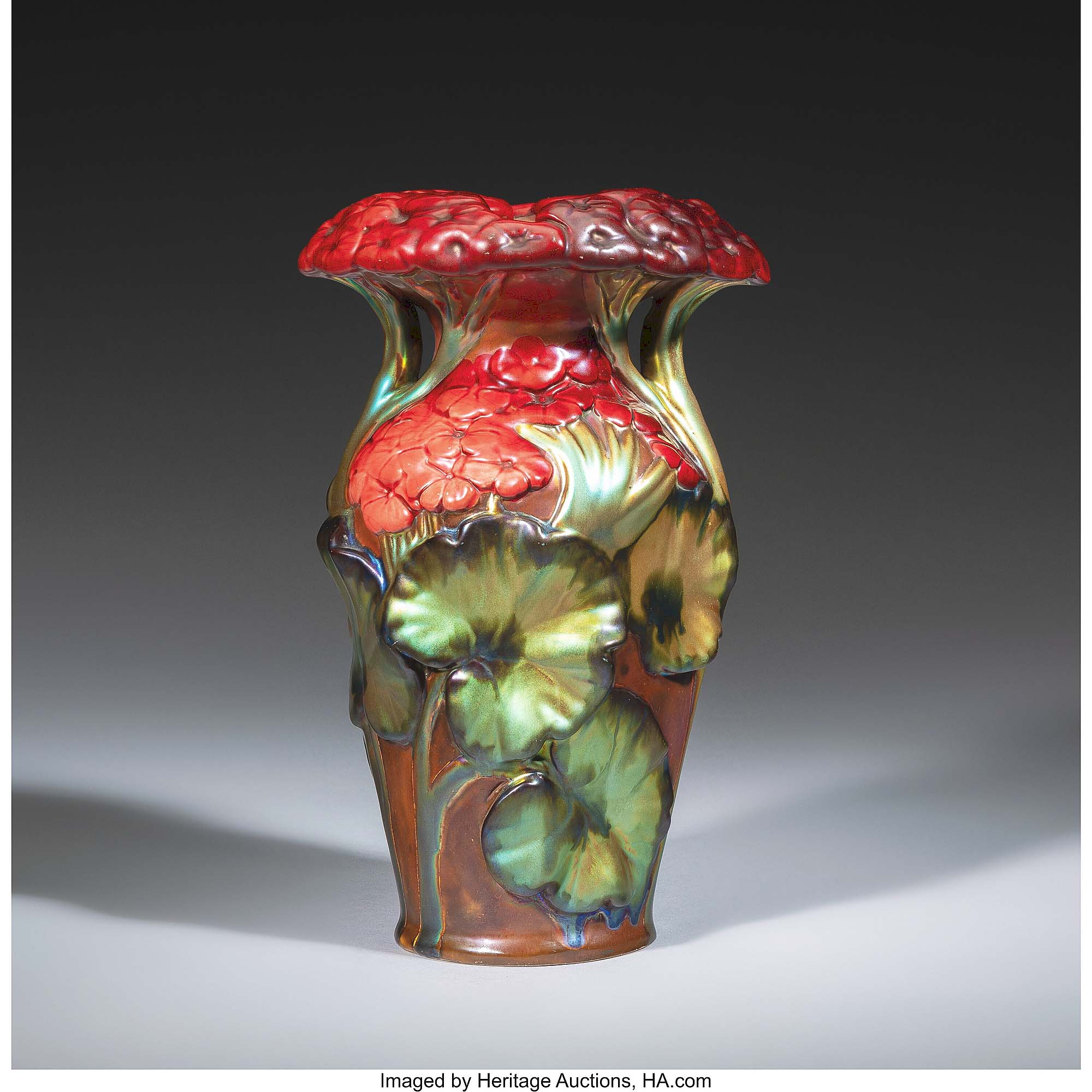 Standing 9½ inches tall, this circa 1900 eosin glazed stoneware