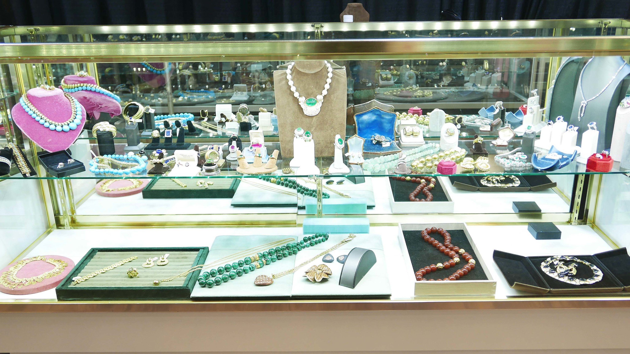 An assortment of fine estate jewelry with Greenwich Bazzar. Gree